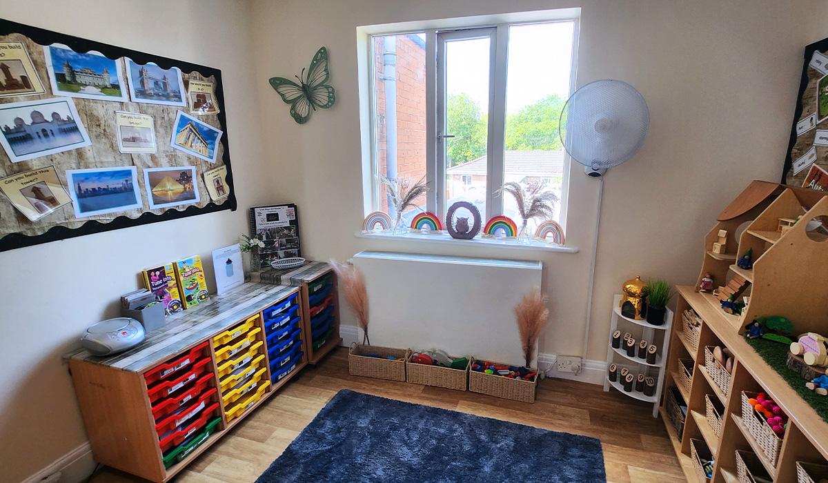 Dark rug on the floor in a room with brightly coloured children