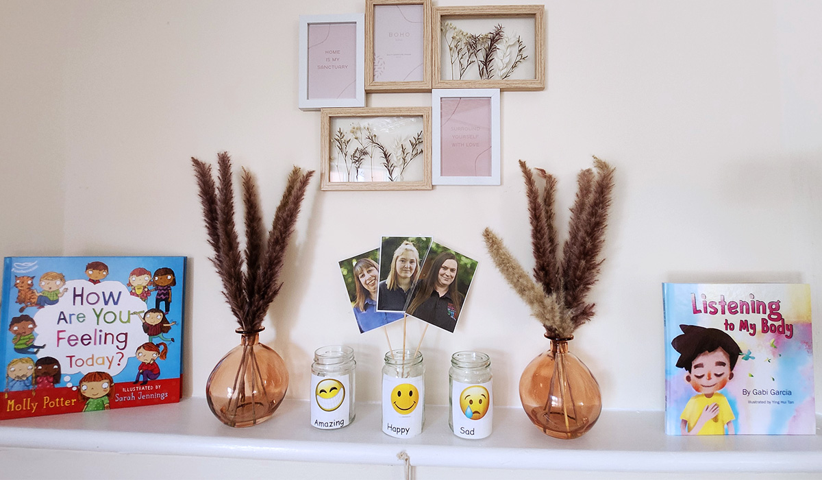 Ornaments on a ledge with pictures of nursery management team at Partou Acorns in Adel nursery and pre-school in Leeds
