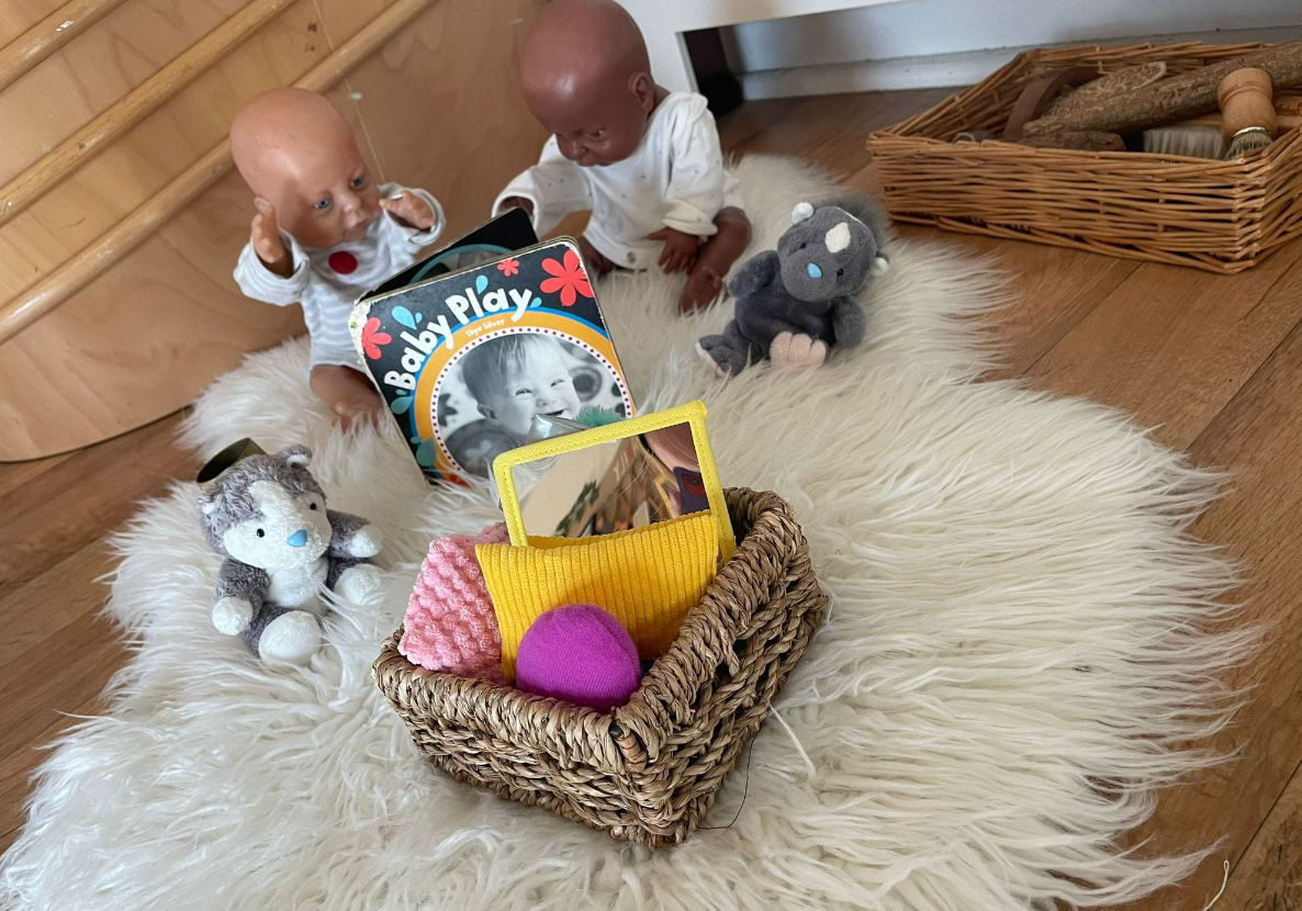 Baby sensory area with basket containing different textures to explore at Sycamore House nursery in Bishop