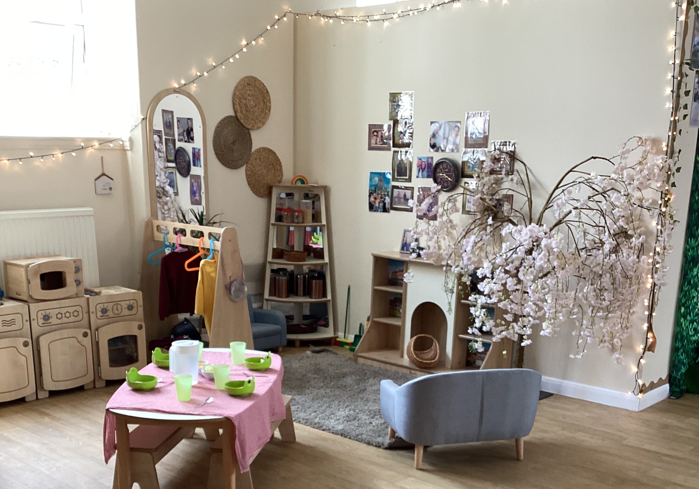 Home role play toys and fake blossom tree at Partou Footprints nursery in Atherton