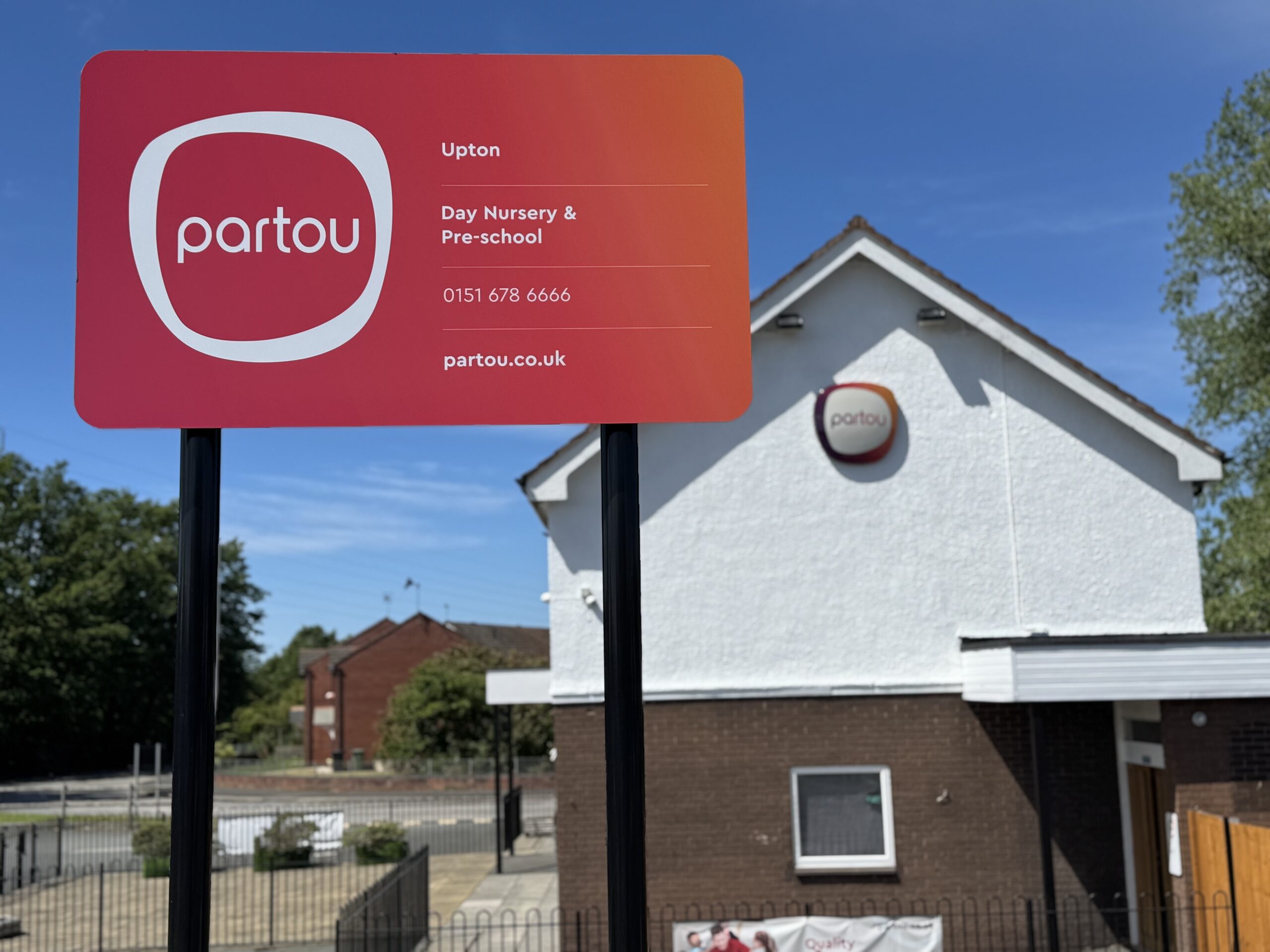 Exterior view of Partou Upton Day Nursery & Pre-School in Prenton, Birkenhead showing signage taken from the side of the building