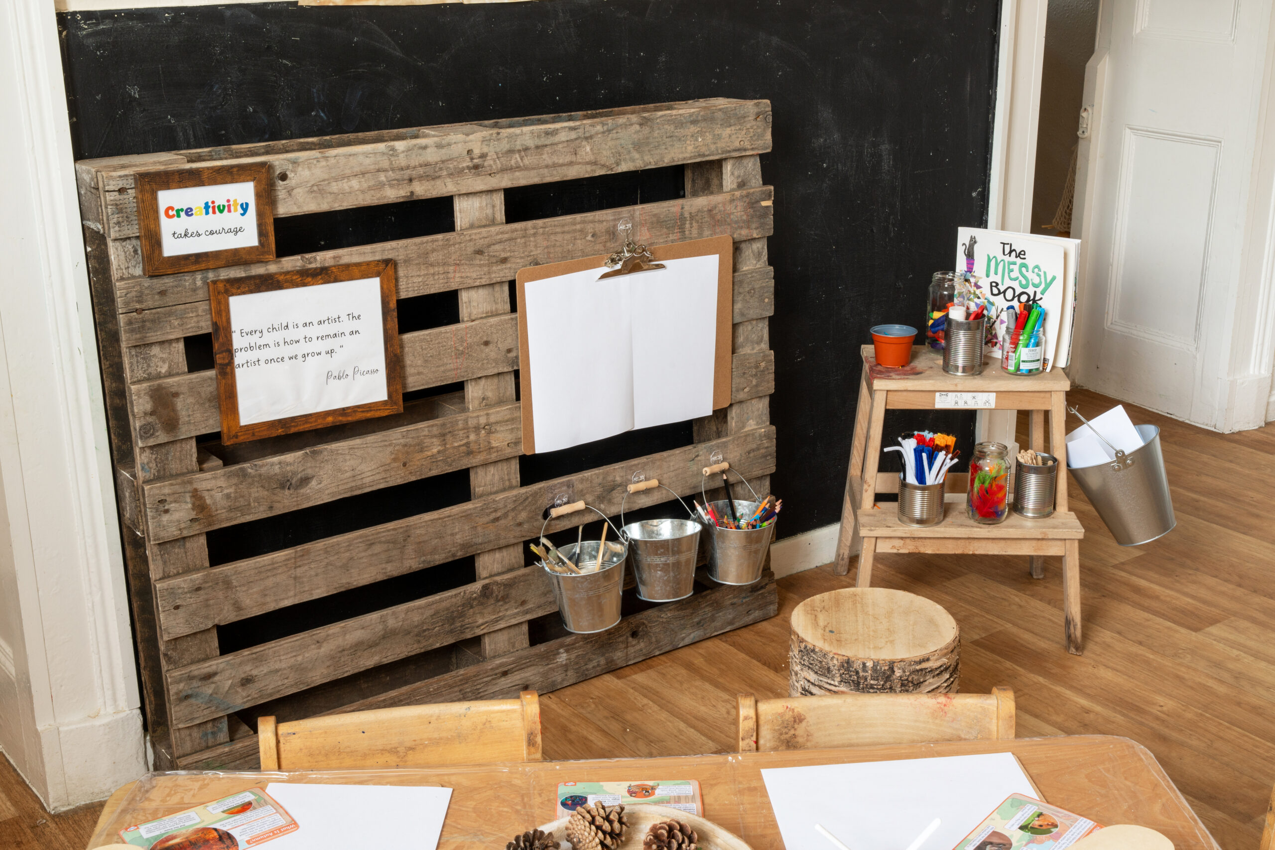 Creative art area with paper and crayons for children to express themselves at Hilltops nursery in Chorley