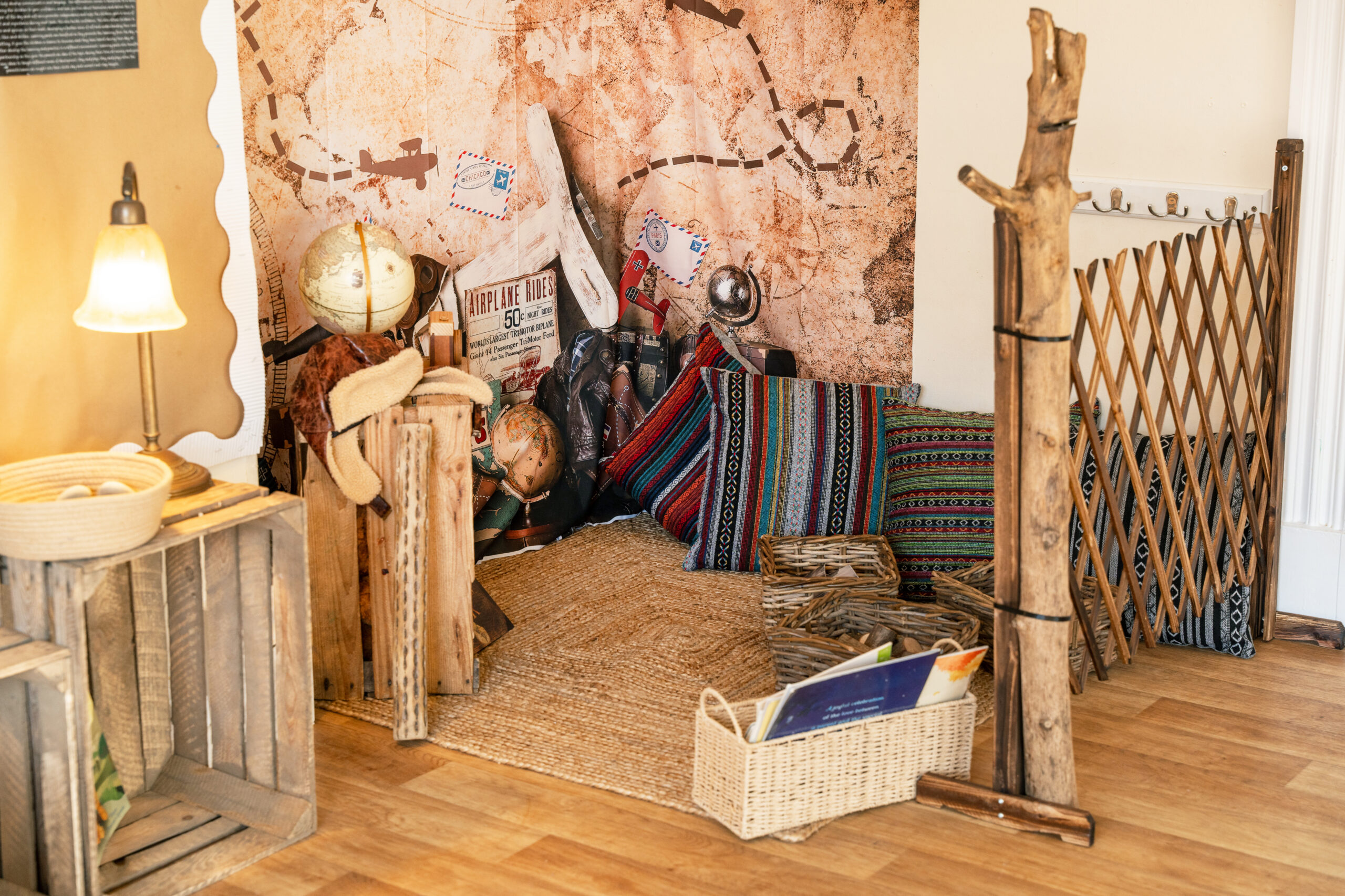 Cosy corner with striped cushions for relaxation and emotional regulation at Hilltops nursery in Chorley