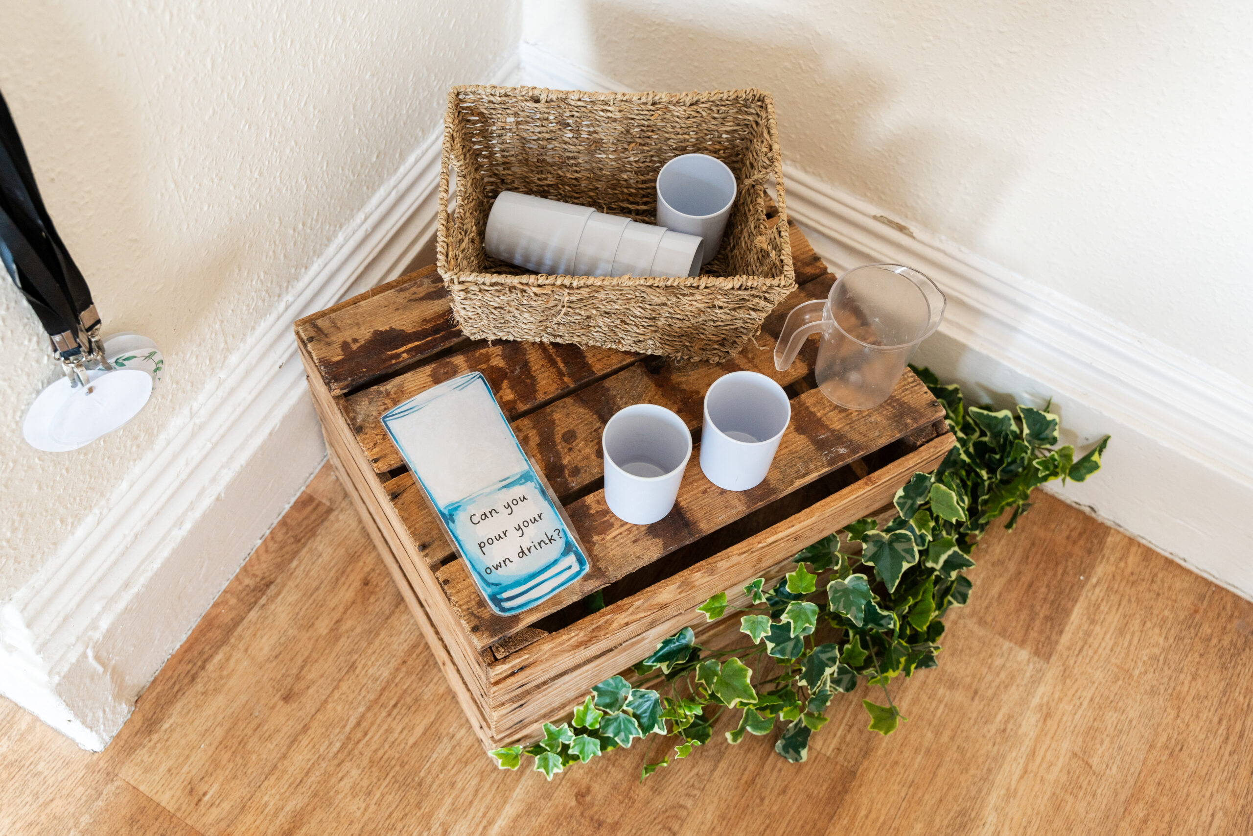 Drink station with cups and water jug to encourage independence at Hilltops nursery in Chorley