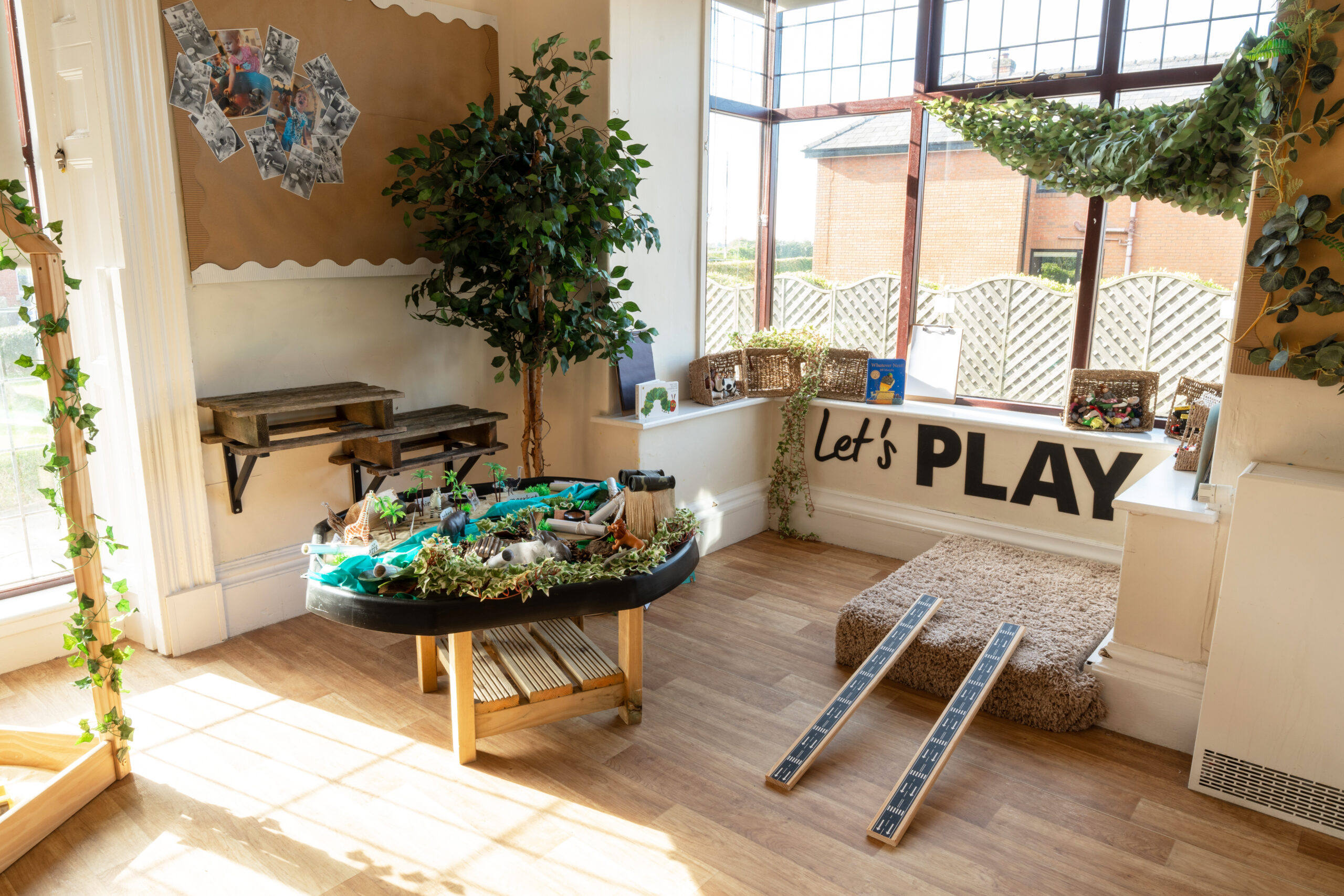 Tough tray sensory play and car tracks in play area at Hilltops nursery in Chorley