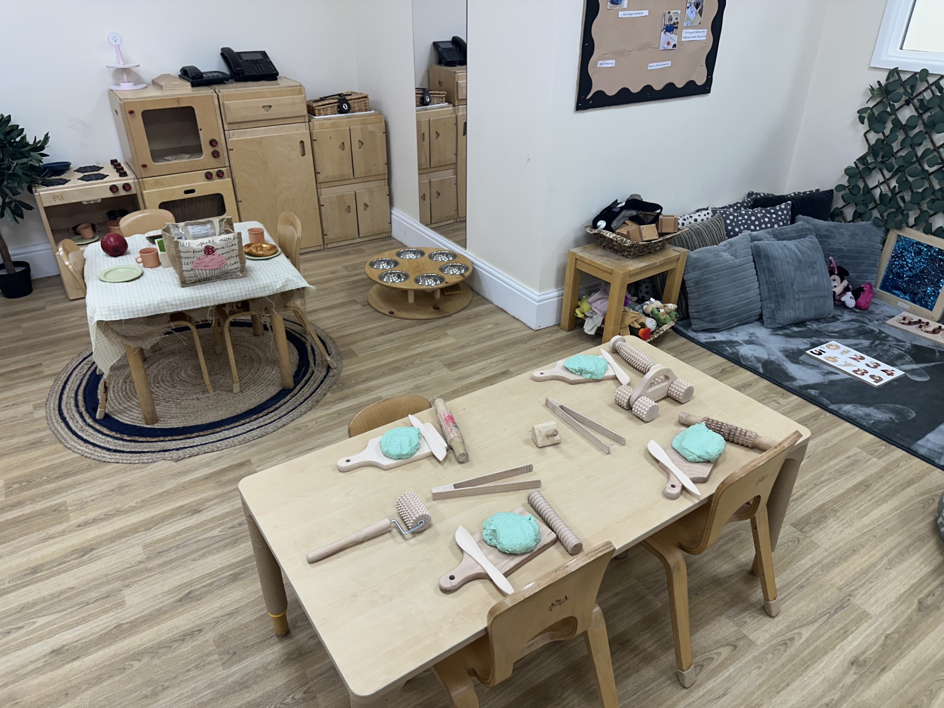Home role play toys and green play dough with cooking utensils for modelling at Partou Upton Day Nursery Prenton