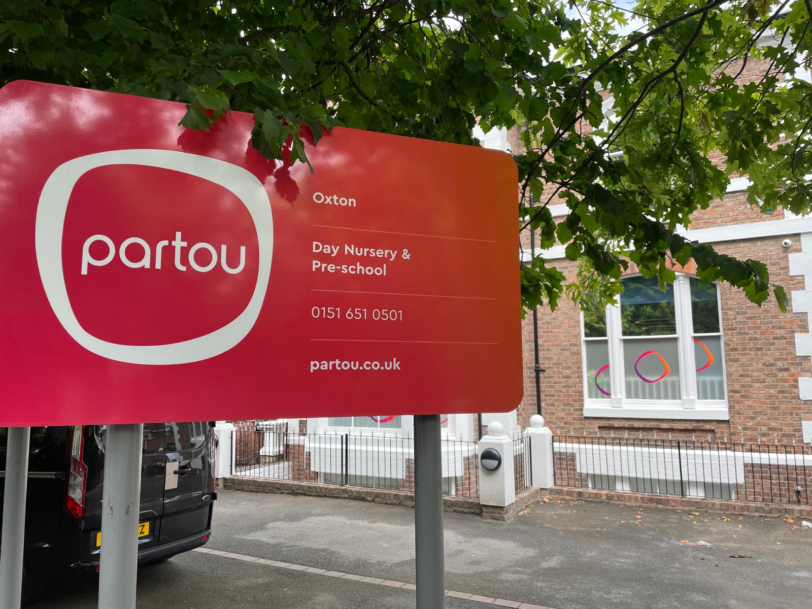 Partou signage outside Oxton Day Nursery and pre-school in Birkenhead