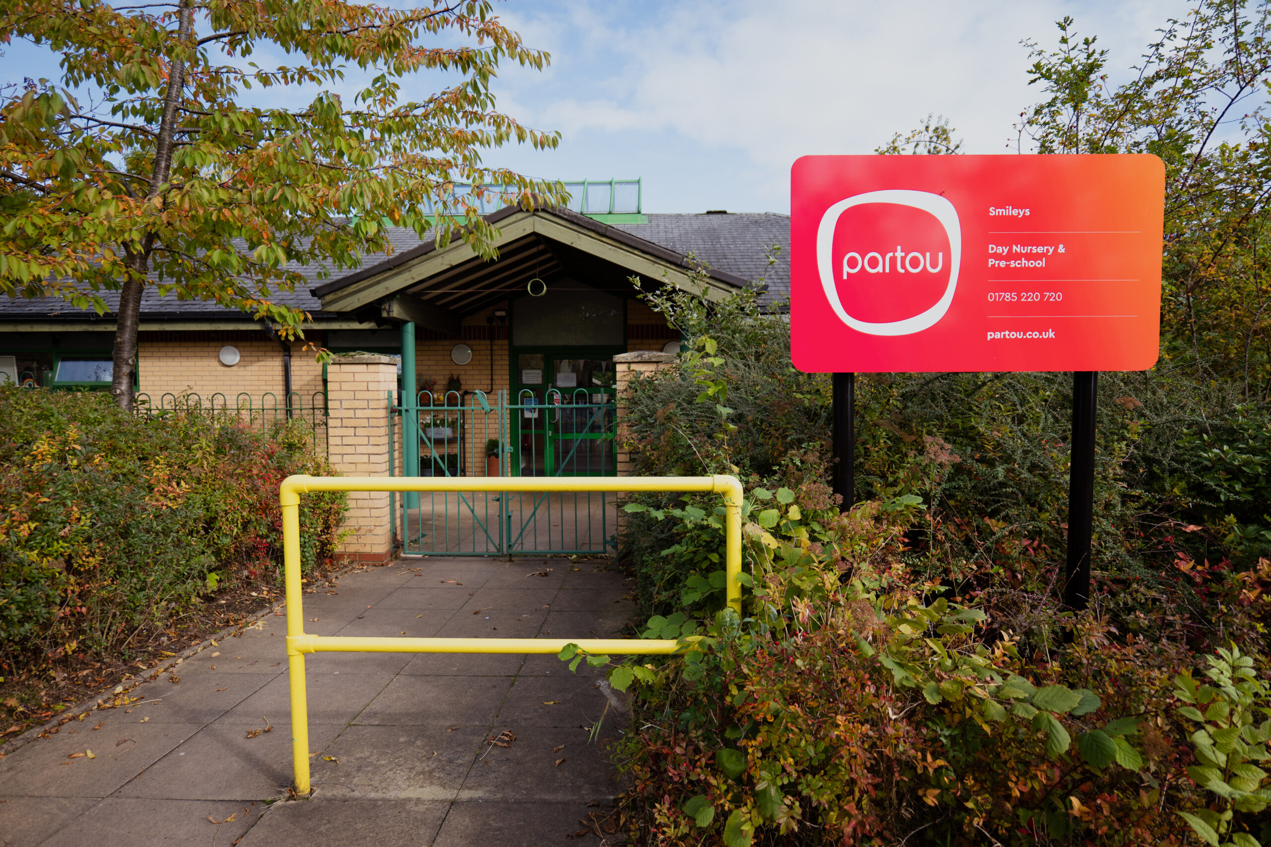 Outdoor view of Smileys day nursery in Stafford with Partou signage outside