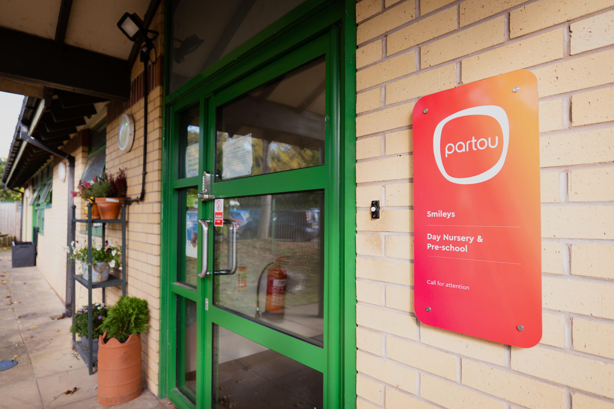Green door and Partou signage outside Smileys Day Nursery in Stafford