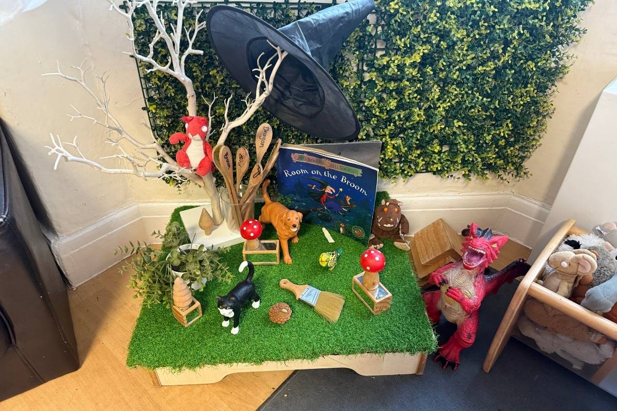 Room on the Broom toddler sensory activity on top of astroturf at Partou Cherubs Day Nursery & Pre-School in Cheshire
