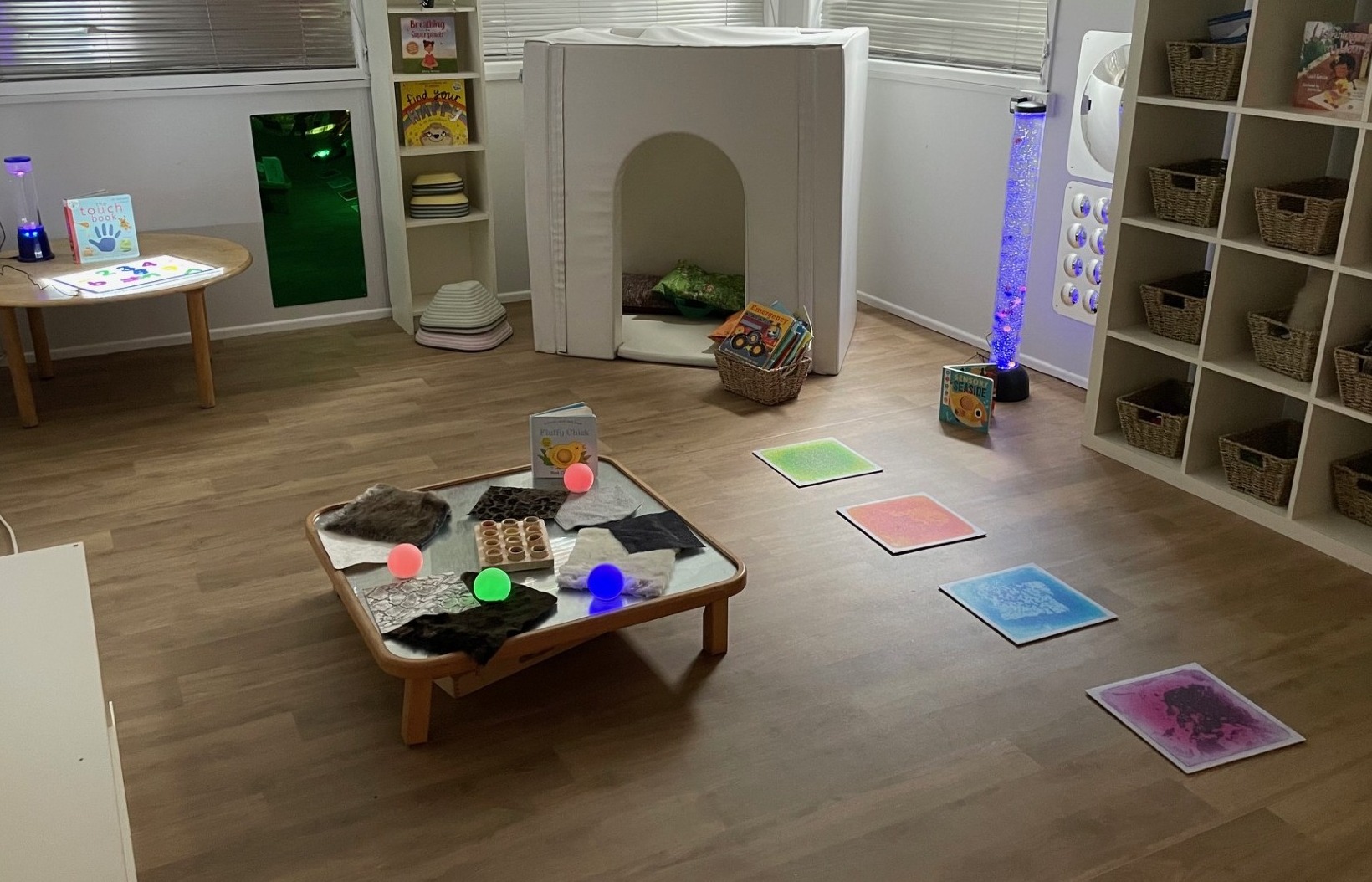 Table with sensory activities, lights and cosy corner at Kids Corner Nursery in Sandbach
