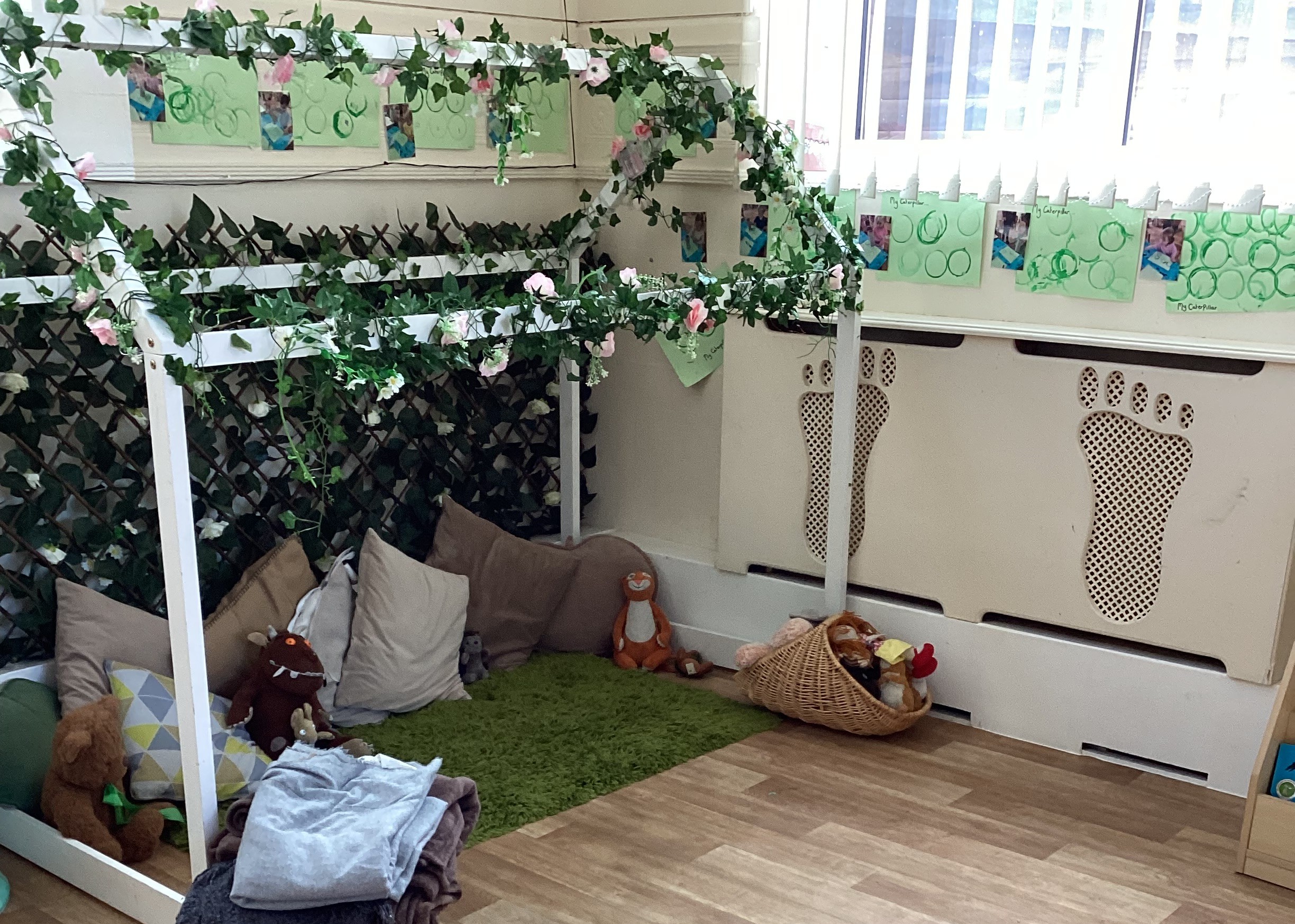 Cushions and mat with various soft toys at Partou Footprints nursery in Atherton