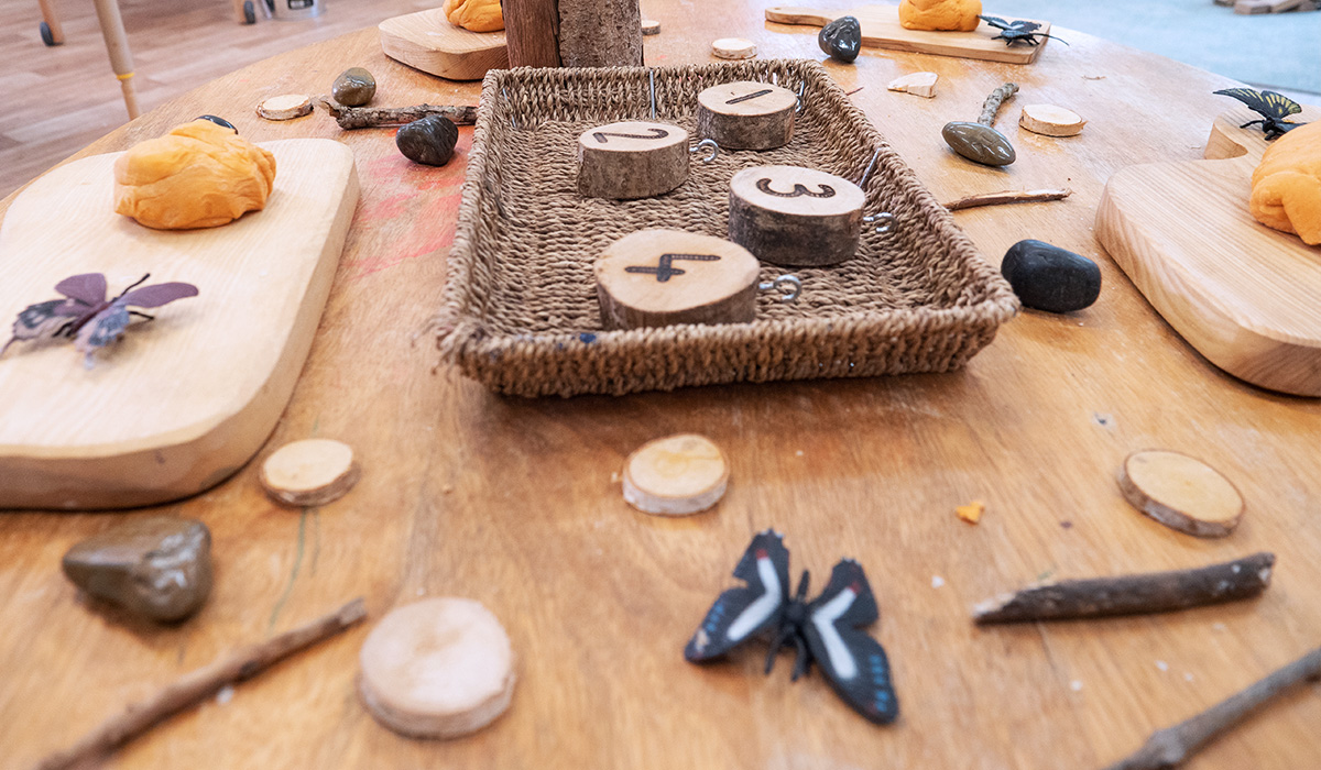 Table with wooden numbers and play dough at Smileys day nursery in Stafford