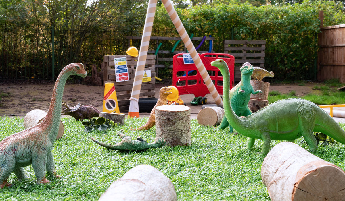 Toy dinosaurs outdoors at Smileys nursery and pre-school in Stafford