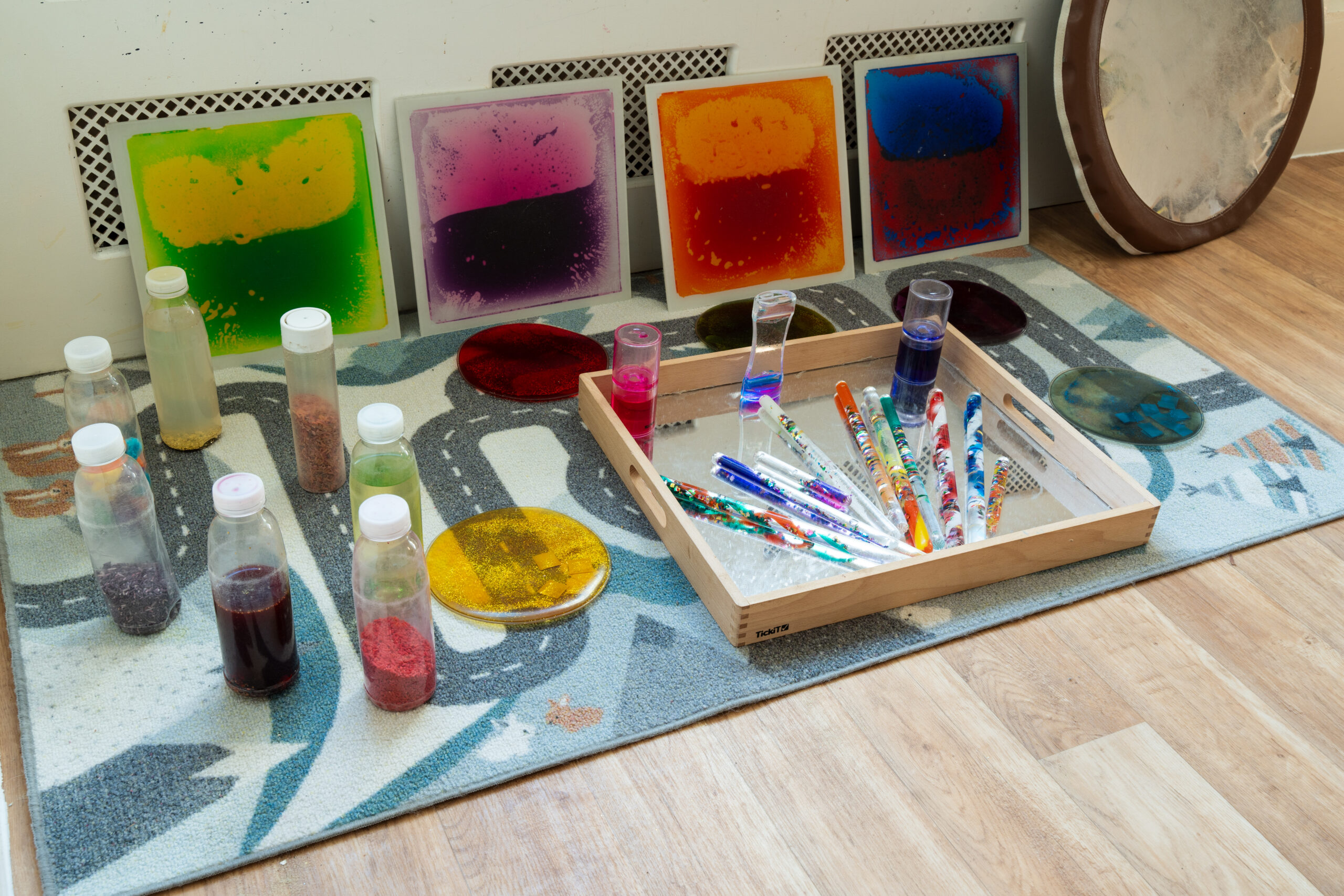 Glitter tubes, shakers and liquid sensory mats for sensory exploration at Safehands nursery in Harrogate