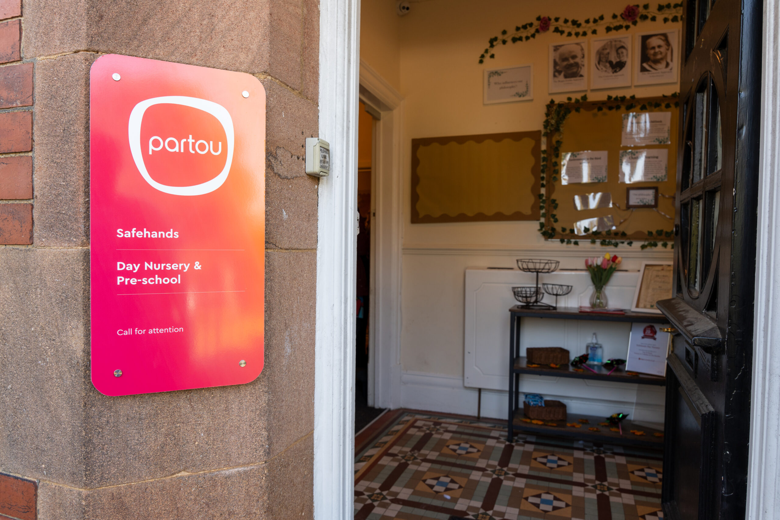 entrance way to Safehands nursery in Harrogate with open door and Partou signage