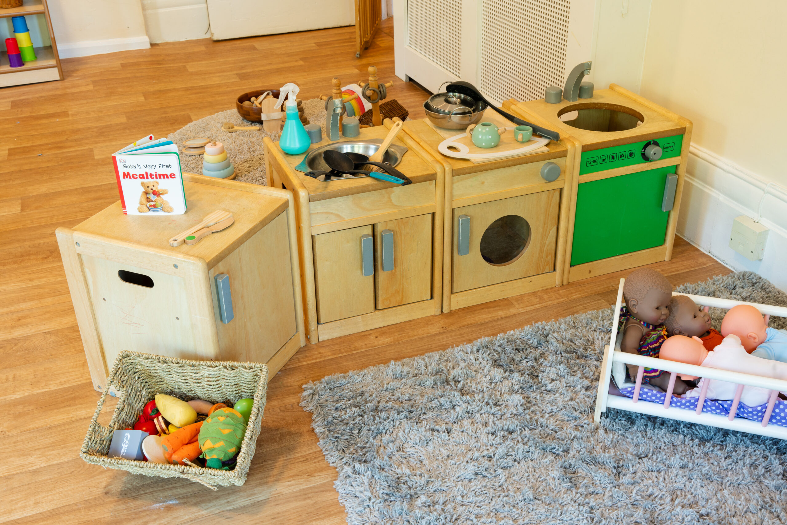 Home from home toys at Safehands nursery in Harrogate including play sink, washing machine and babies