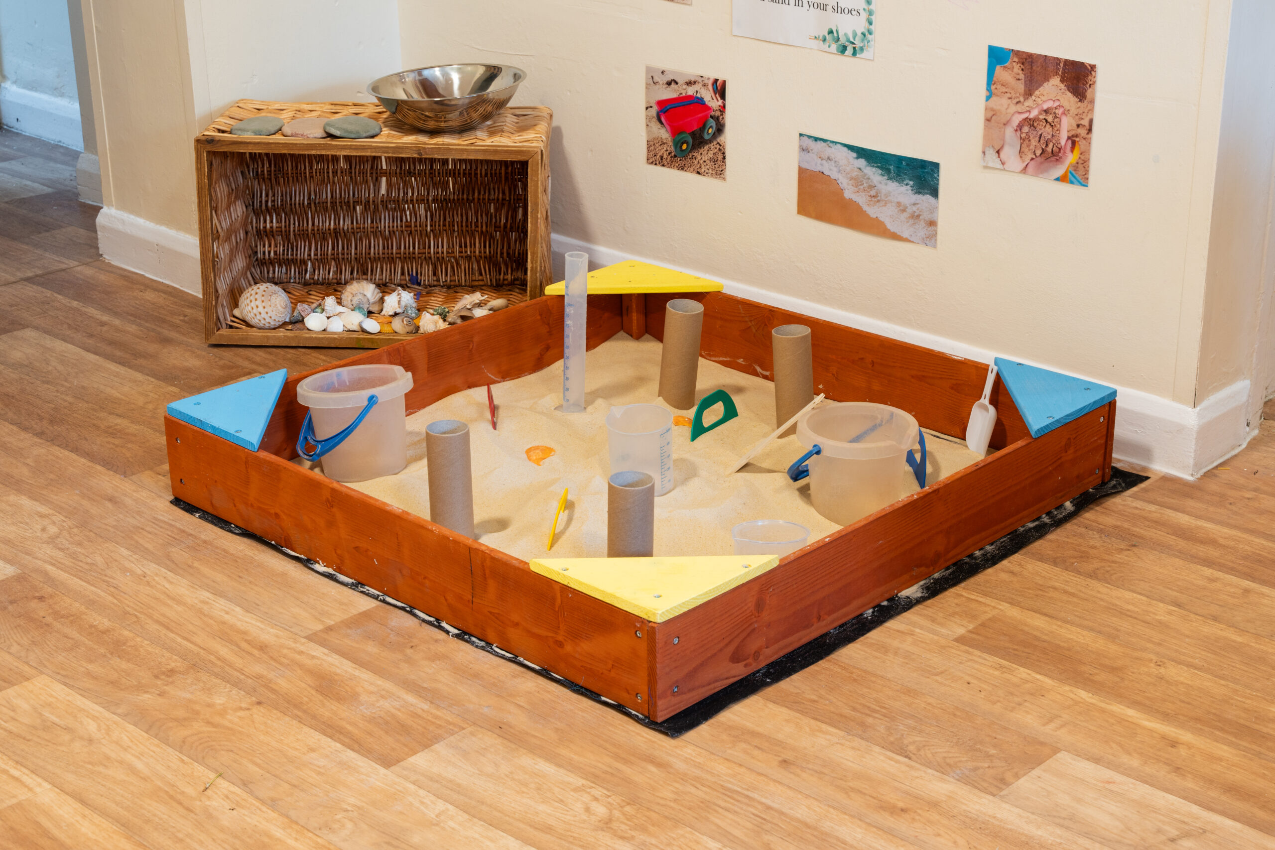 Sandpit with pouring utensils at Safehands nursery in Harrogate