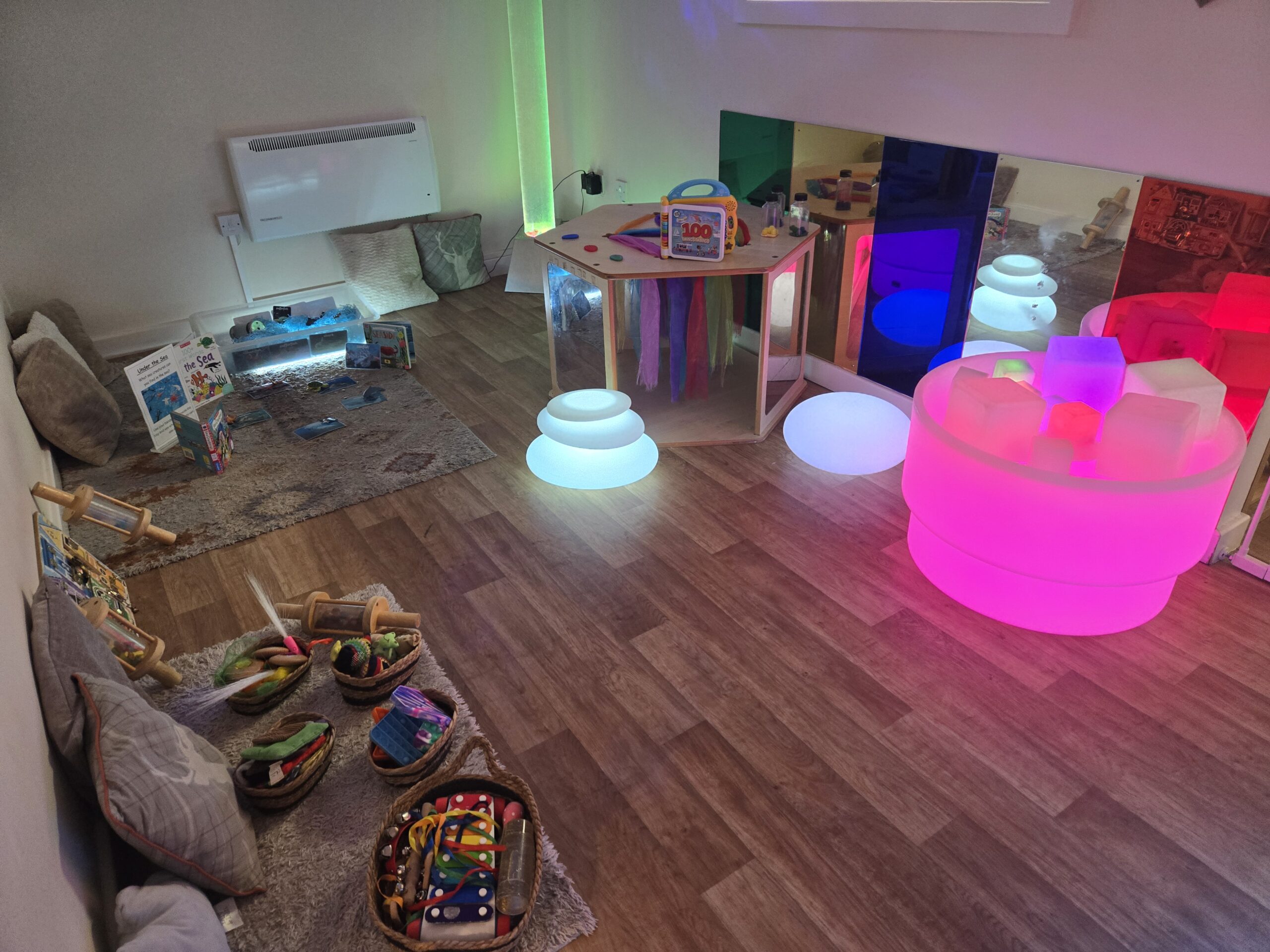 Sensory room with glowing lights and natural resource toys at Partou Acorns in Adel nursery and pre-school in Leeds