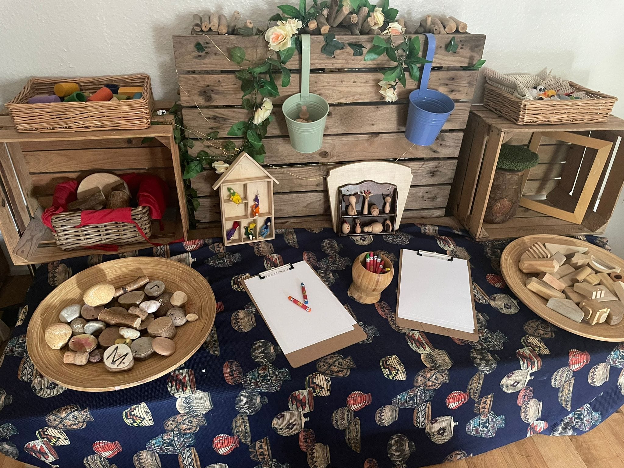 Wooden blocks and stone exploration area for pre-schoolers at Sycamore House in Bishop