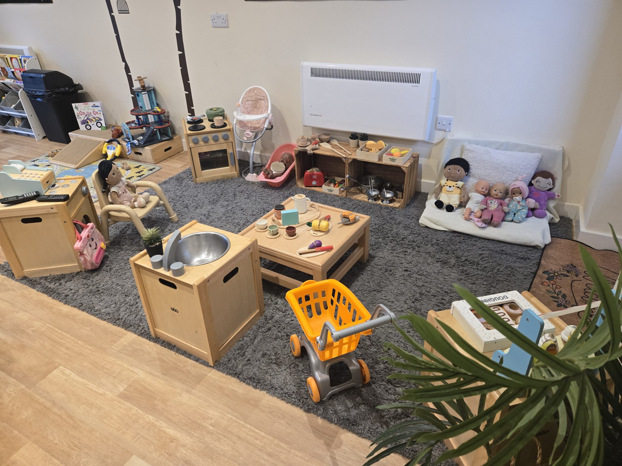 Wooden home kitchen role play toys at Partou Acorns in Adel nursery and pre-school in Leeds