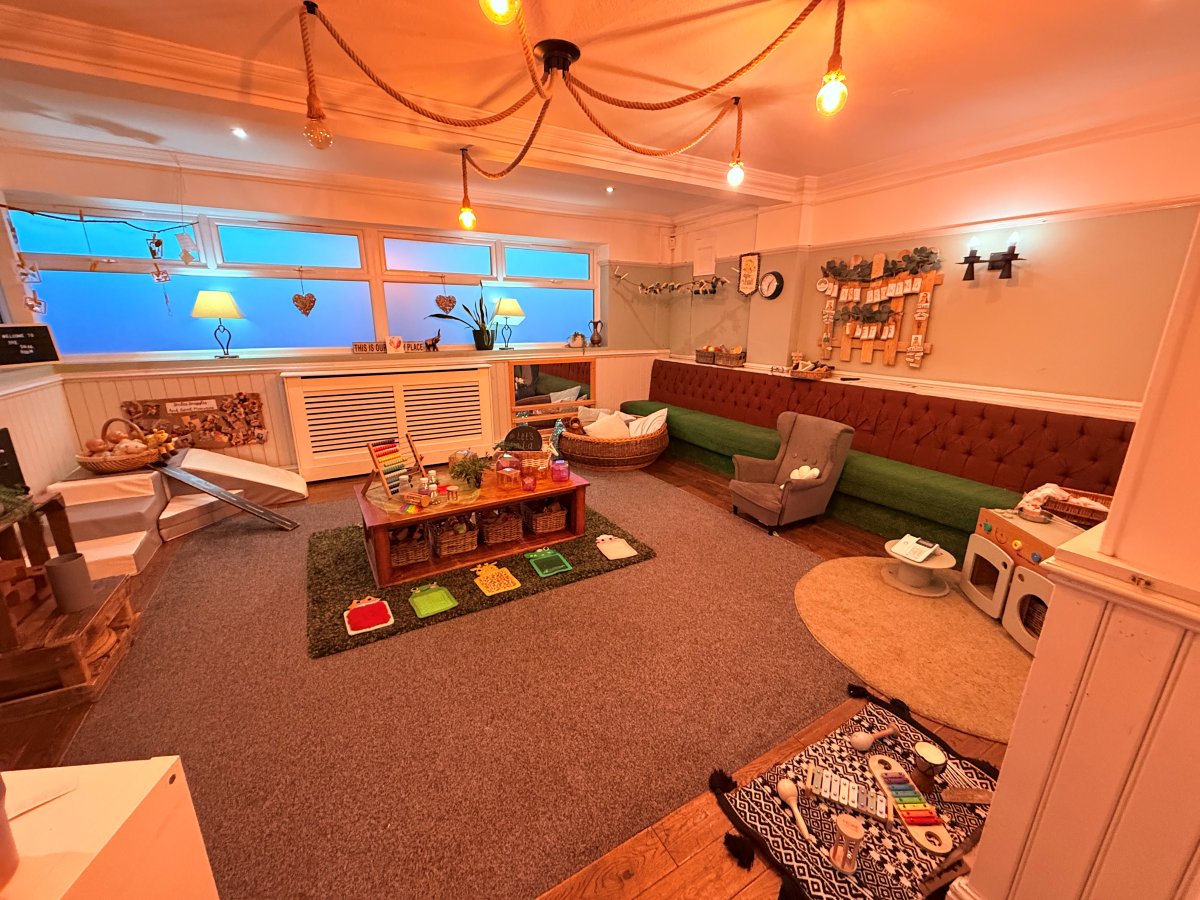 Cosy early years playroom at Partou The Railway Euxton Day Nursery with sensory table, musical instruments and imaginative play areas