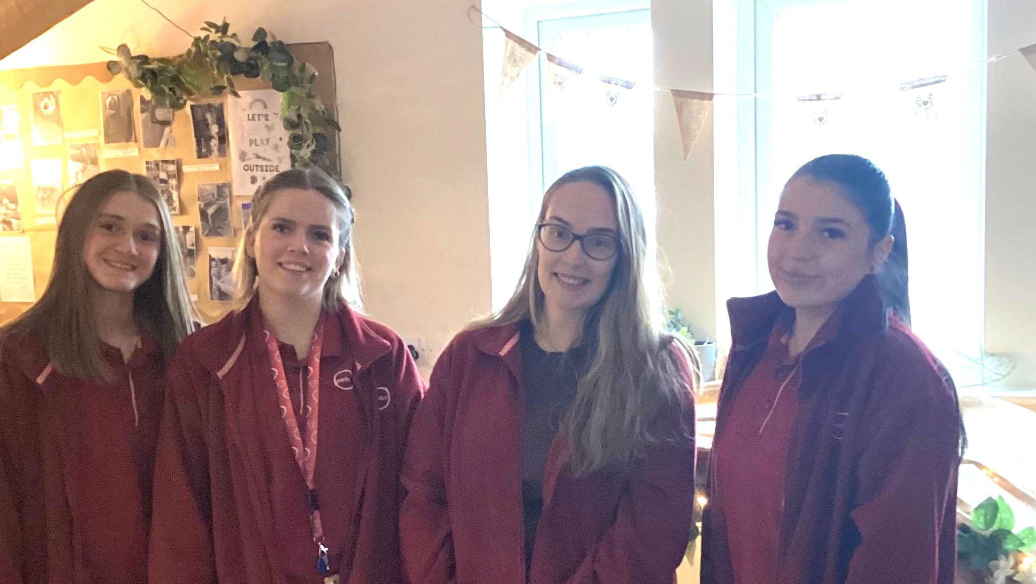 Team members from Partou Stonehouse Day Nursery & Pre-School stand together in one of the nursery